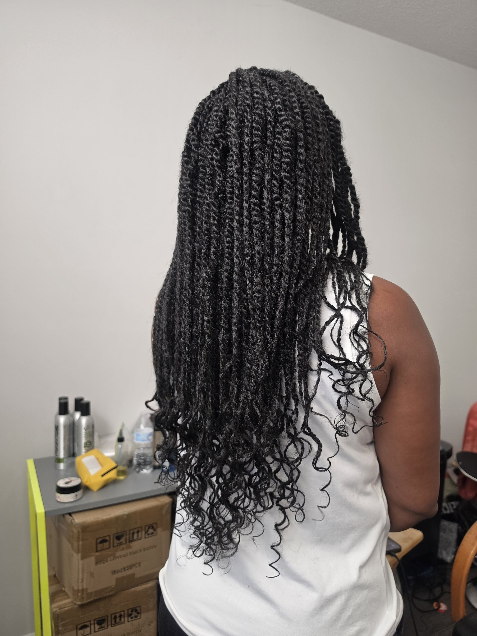 Long twists with curly ends, back view