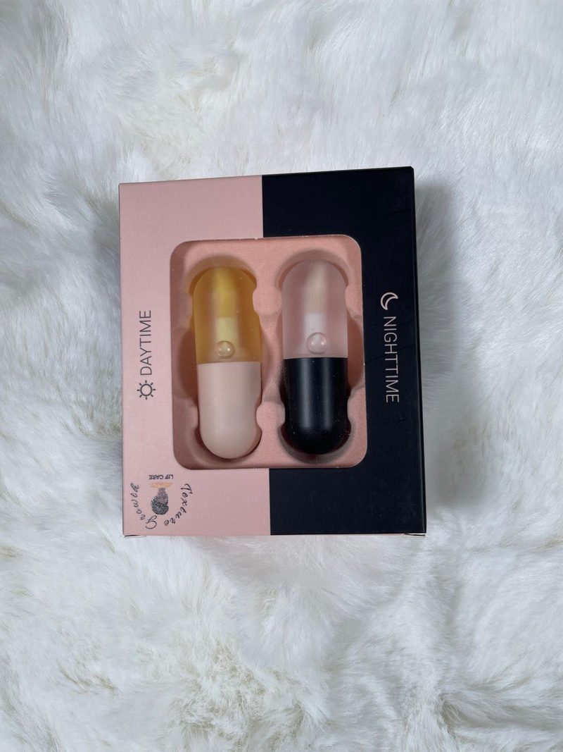 Texture Growth Lip Care set box with Daytime and Nighttime lip plumpers on a white fur background