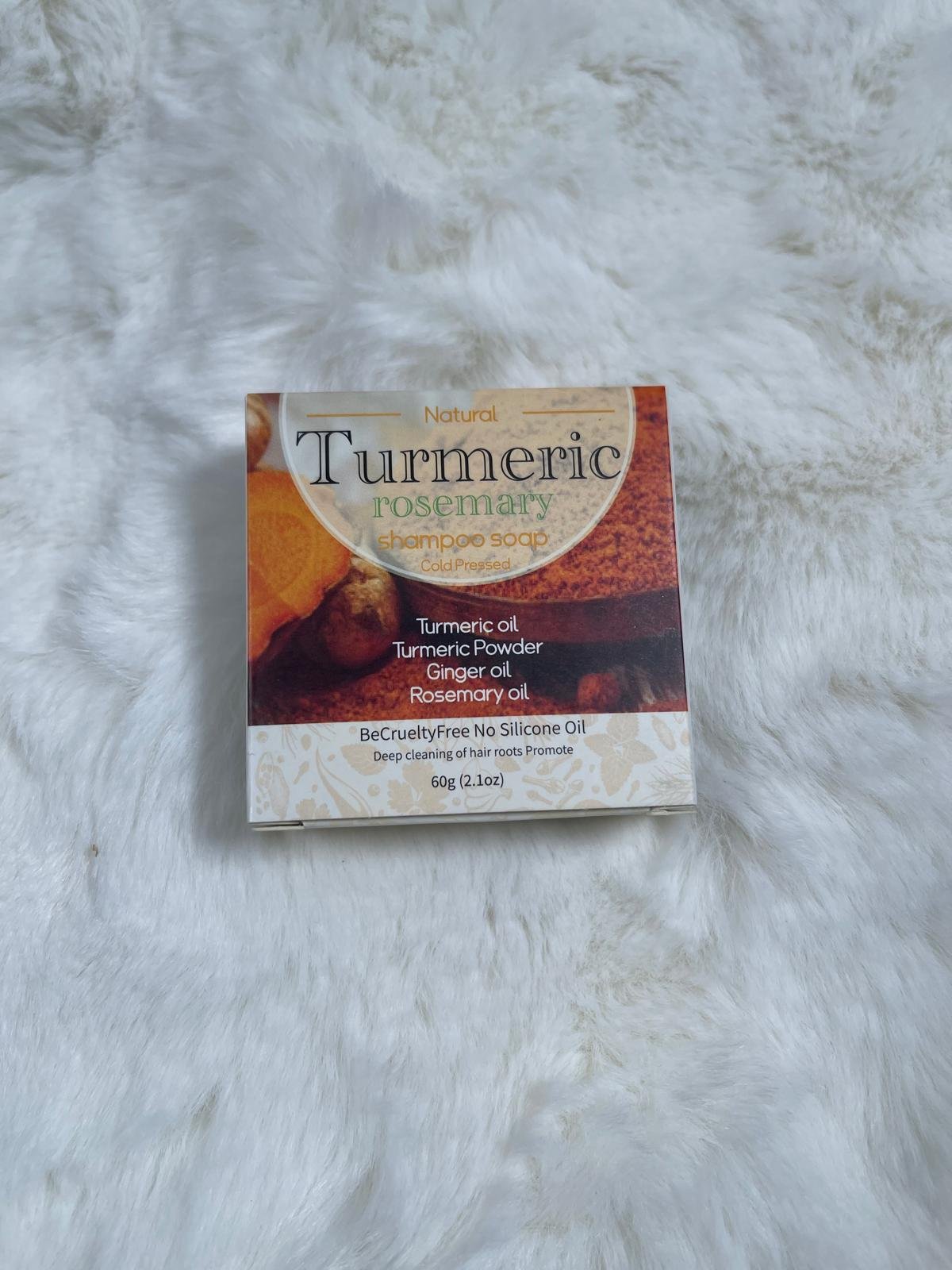 Turmeric Rosemary Shampoo Soap box on a white fur background